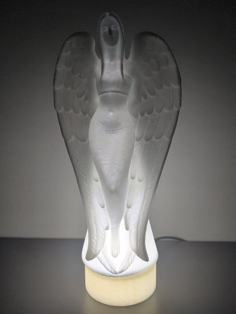 Lampe statuette allumée d'une Ange Femme vue de face